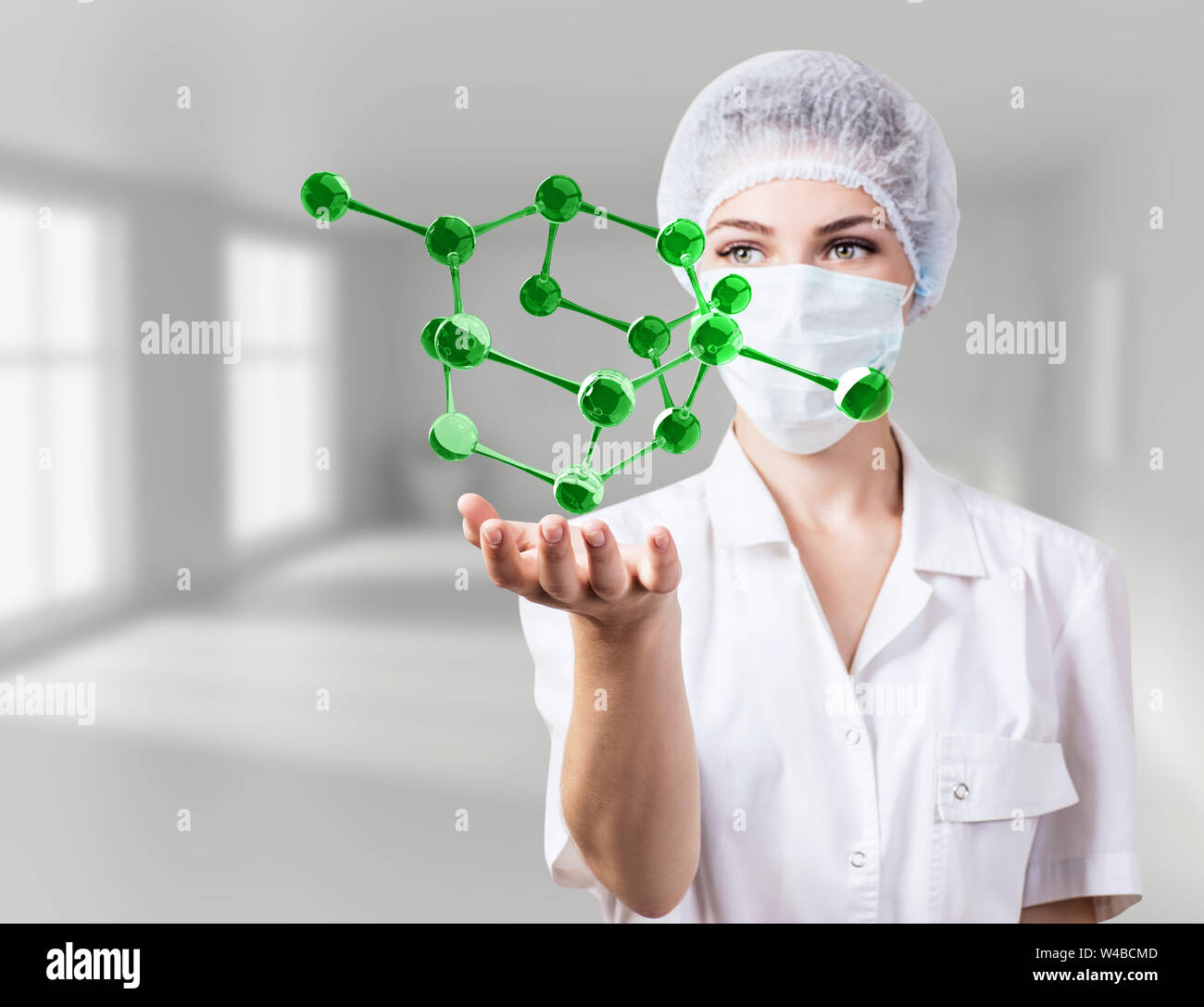 Doctor woman demonstrate virtual molecules in hands. Stock Photo