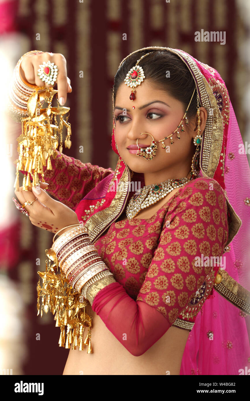 Traditional indian bride looking away hi res stock photography and