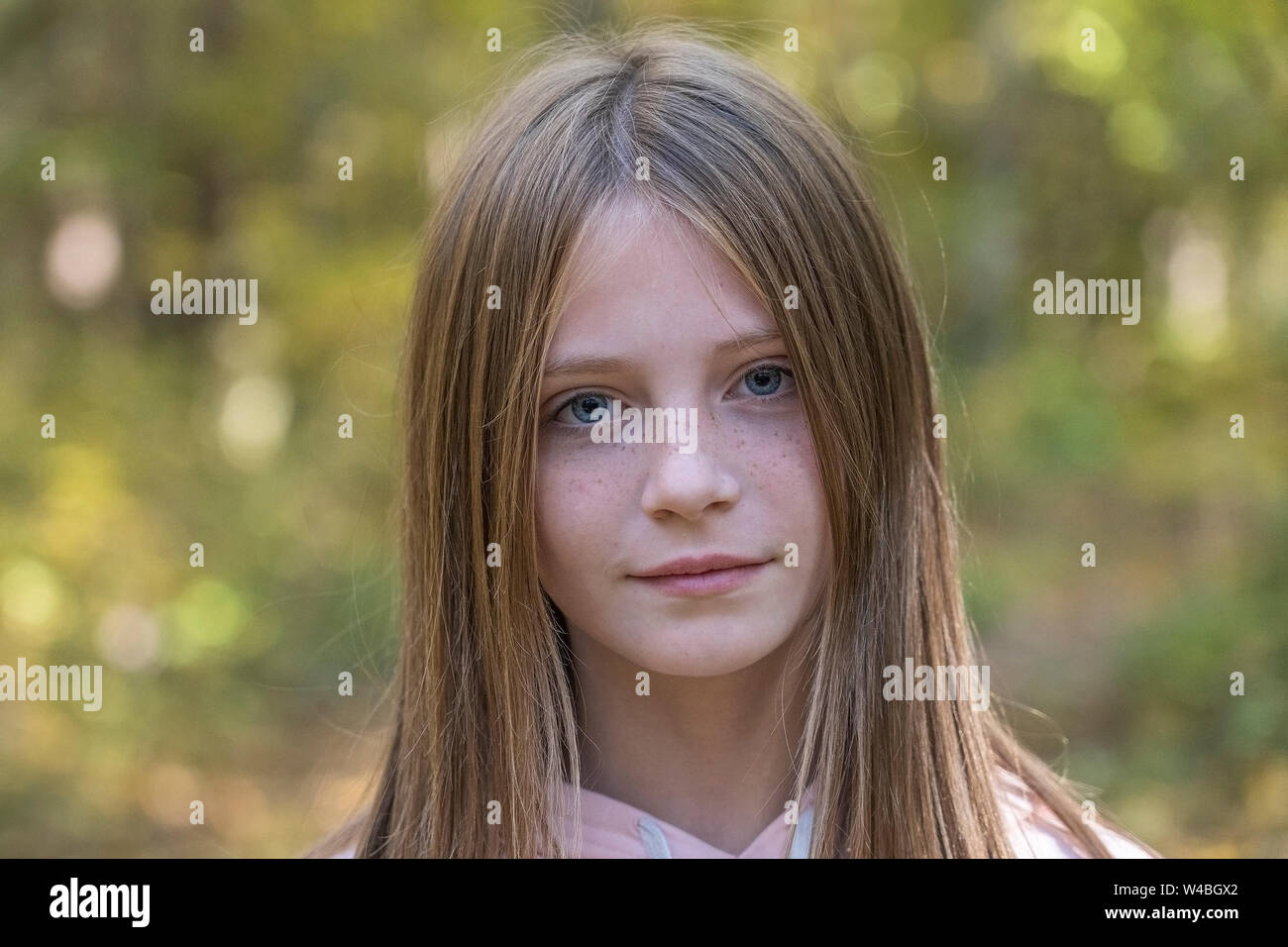 Pretty Young Blonde Girl With Freckles On The Autumn Landscape