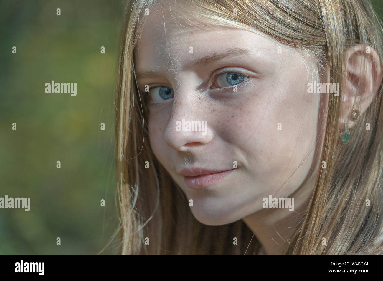 Pretty Young Blonde Girl With Freckles On The Autumn Landscape