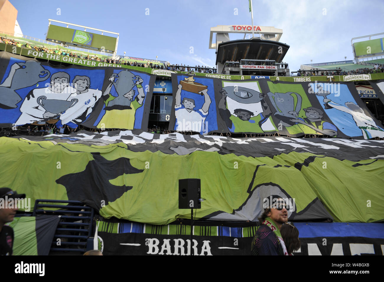 Seattle, WA, USA. 21st July, 2019. MLS Soccer 2019: The Emerald City Supporters show their support with a giant Tifo at the start of a Western Conference MLS match between the Portland Timbers and the Seattle Sounders at Century Link Field in Seattle, WA. Credit: Jeff Halstead/ZUMA Wire/Alamy Live News Stock Photo