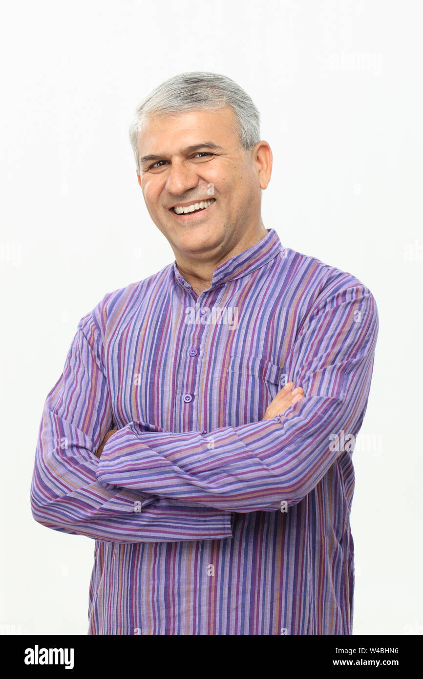 Old man smiling with his arms crossed Stock Photo - Alamy