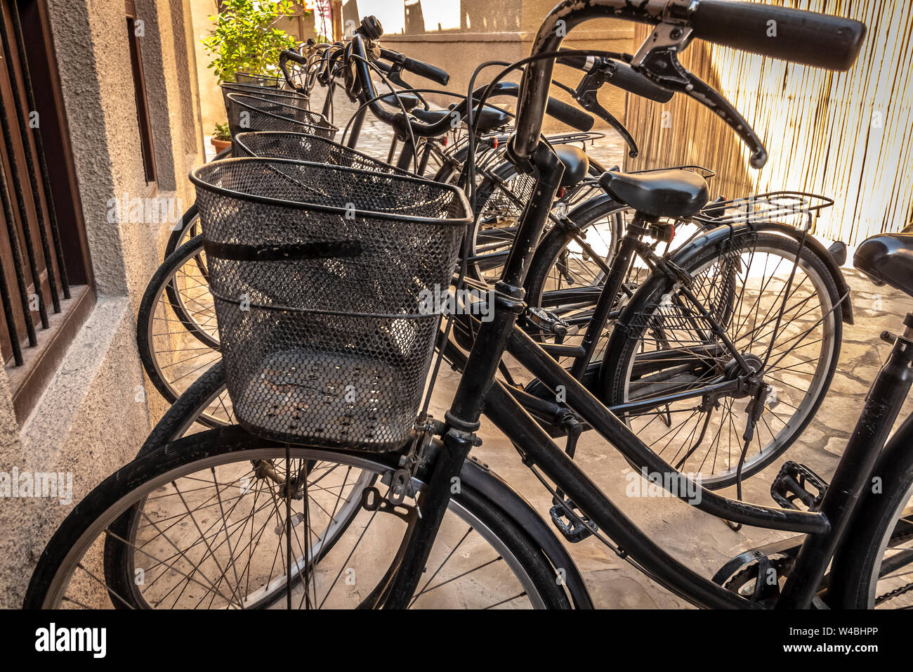 Urban road bike parking with cargo baskets Stock Photo Alamy
