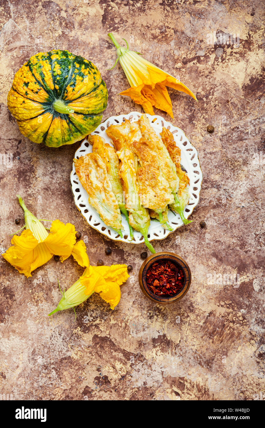 Fried zucchini flowers stuffed with cream cheese.Italian cuisine Stock