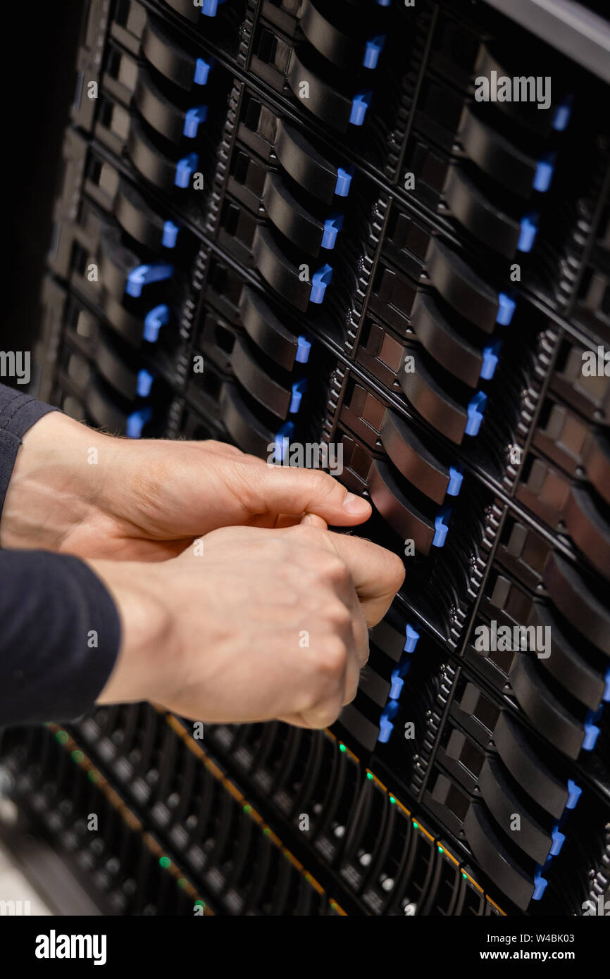 IT Consultant Installing Server Drive In San Stock Photo