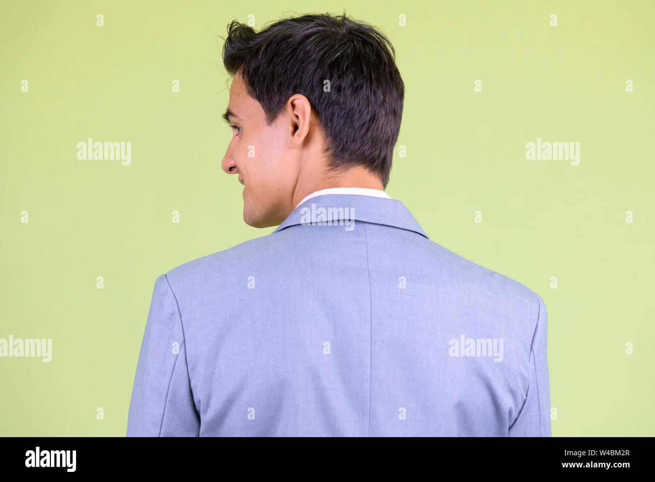 Closeup rear view of happy young handsome businessman smiling Stock ...