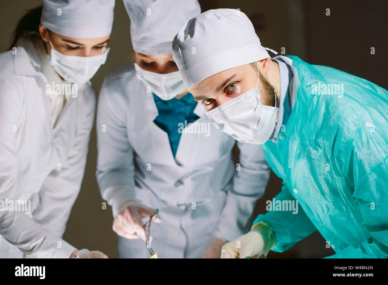 The Surgeon And His Assistants Makes An Operation Stock Photo Alamy