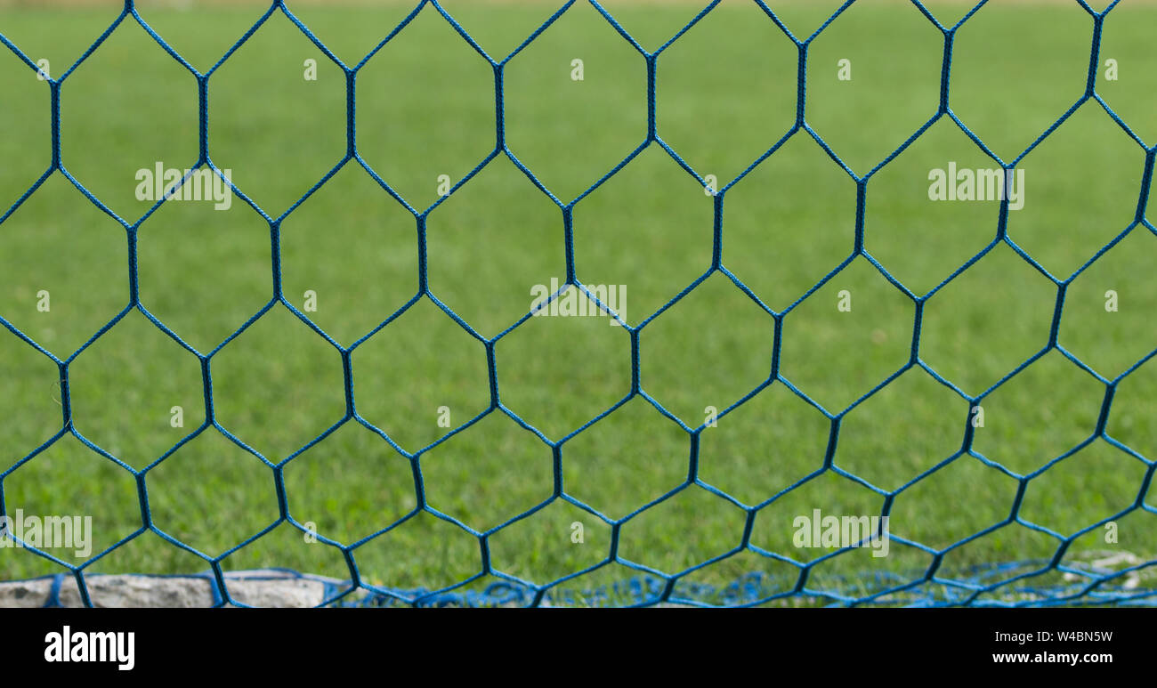 Soccer or football net background. Football net close up on blurred
