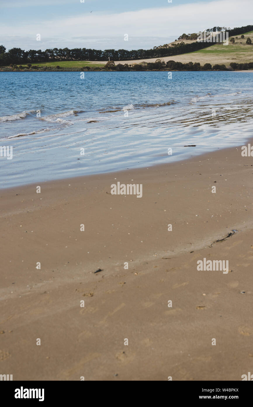 sunny Australian beach in Cremorne, Tasmania looking beautiful and