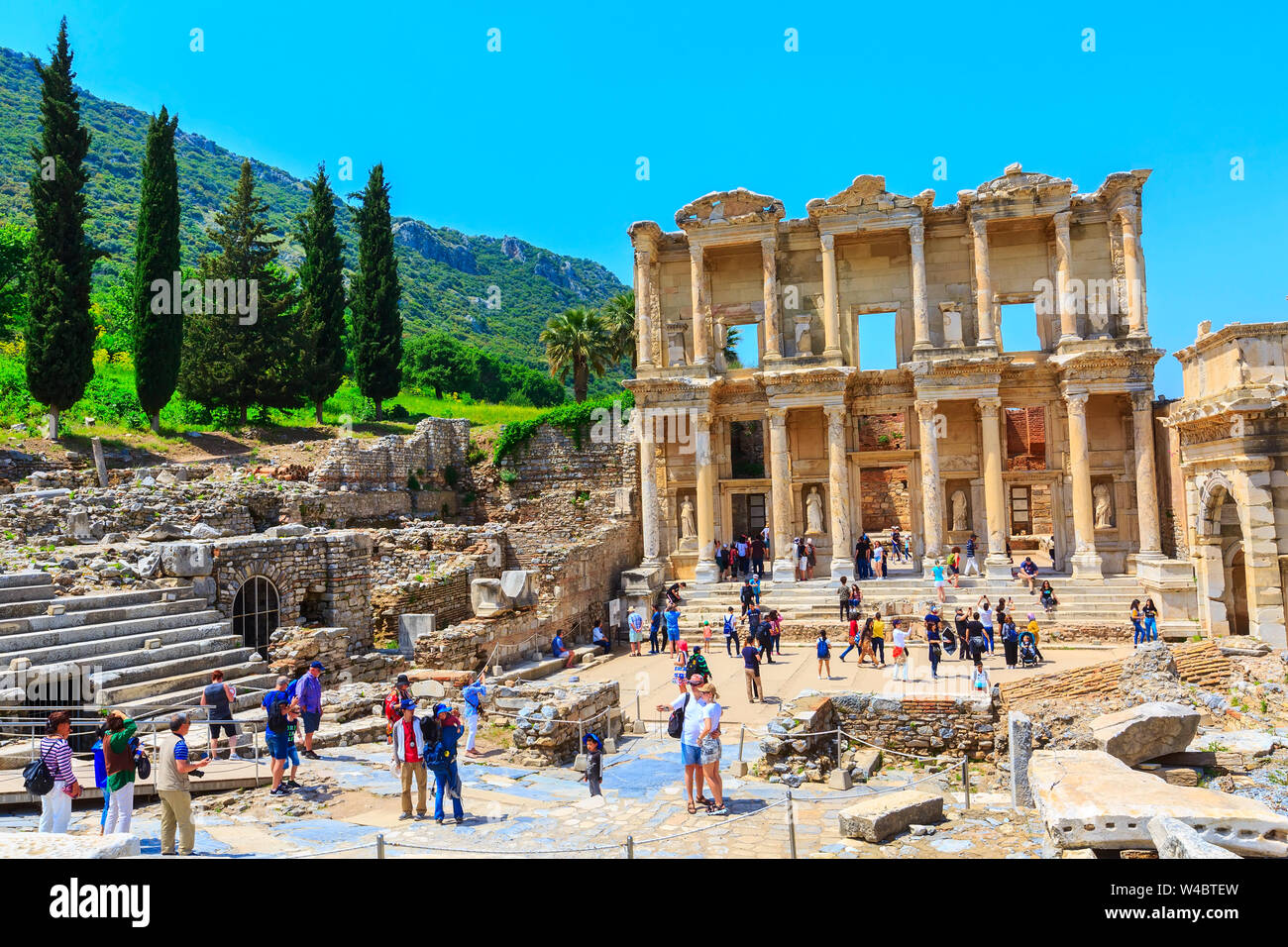 Kusadasi, Turkey - April 28, 2019: People visiting Celsus Library and old ruins of Ephesus or Efes famous site Stock Photo