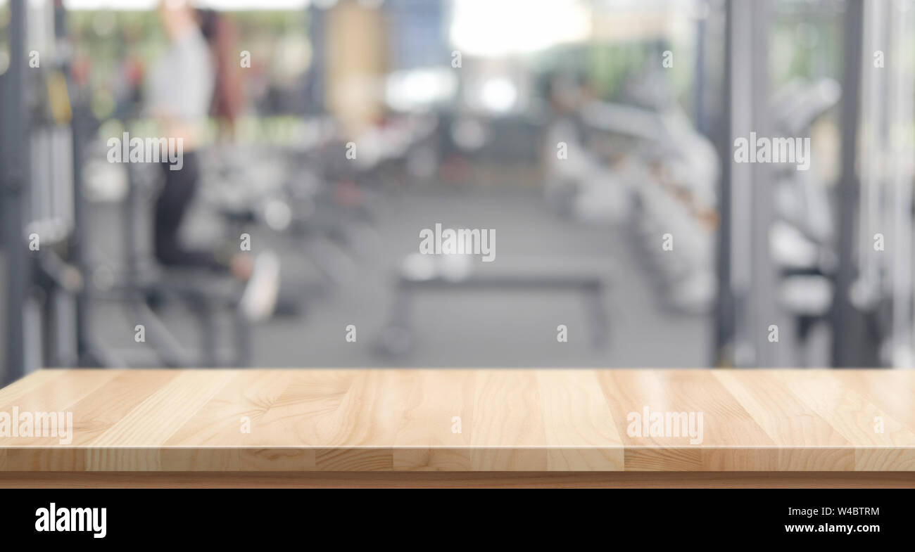 Empty wood table space platform and fitness gym background Stock Photo