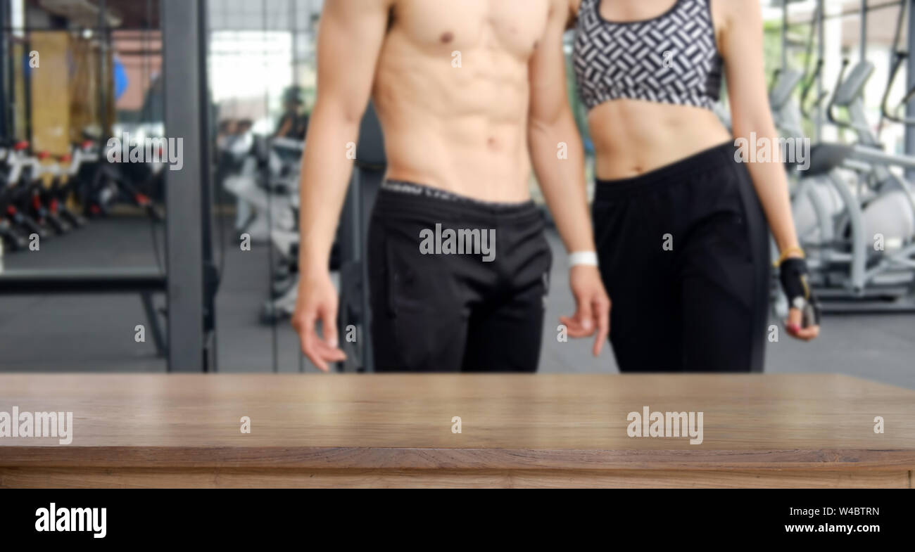 Empty wood table space platform and fitness gym Stock Photo
