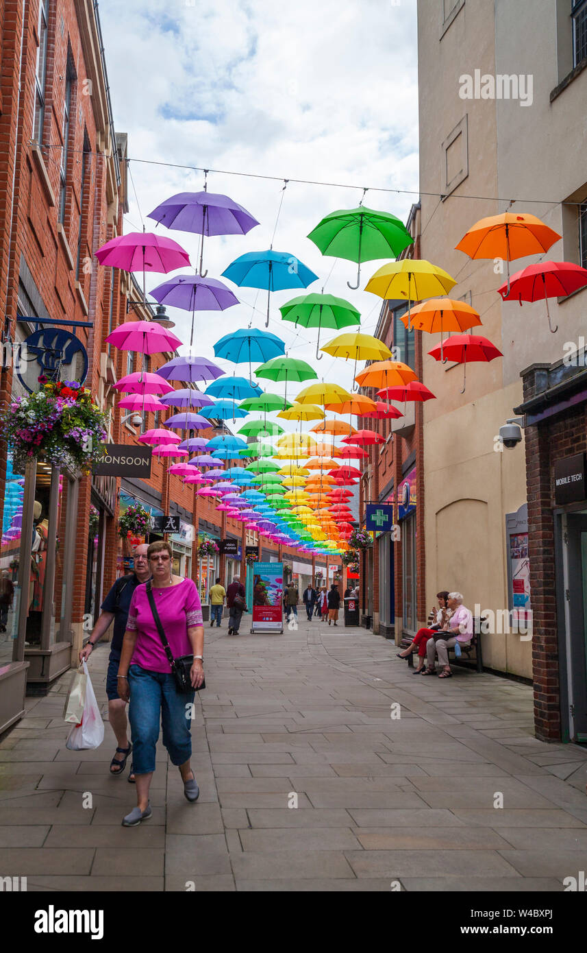 A colourful display of umbrellas hanging overhead in the Prince shopping precinct in