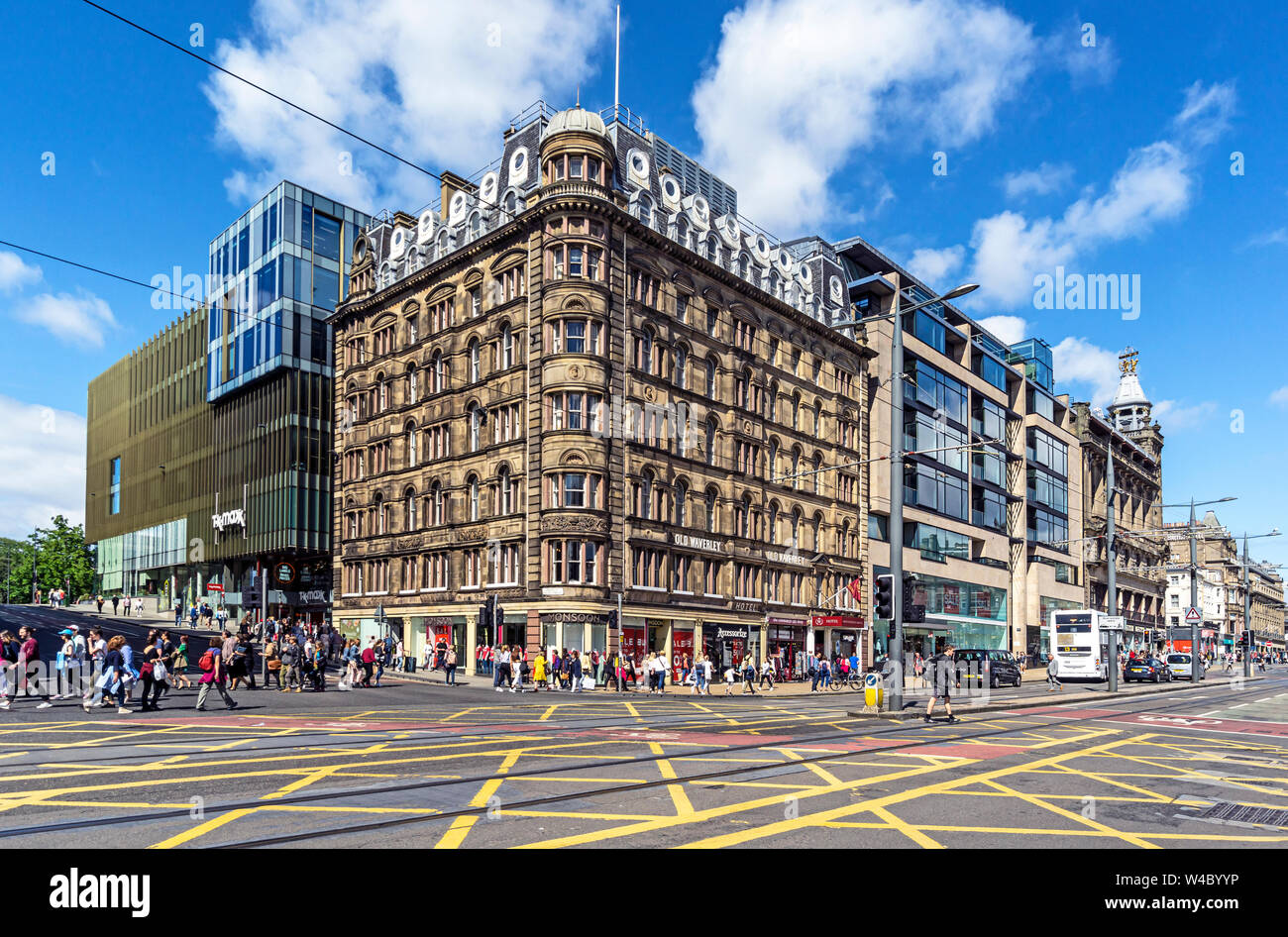 The Old Waverley Hotel on the corner of South St. David Street and Princes Street in Edinburgh Scotland UK with tourists and pedestrians Stock Photo
