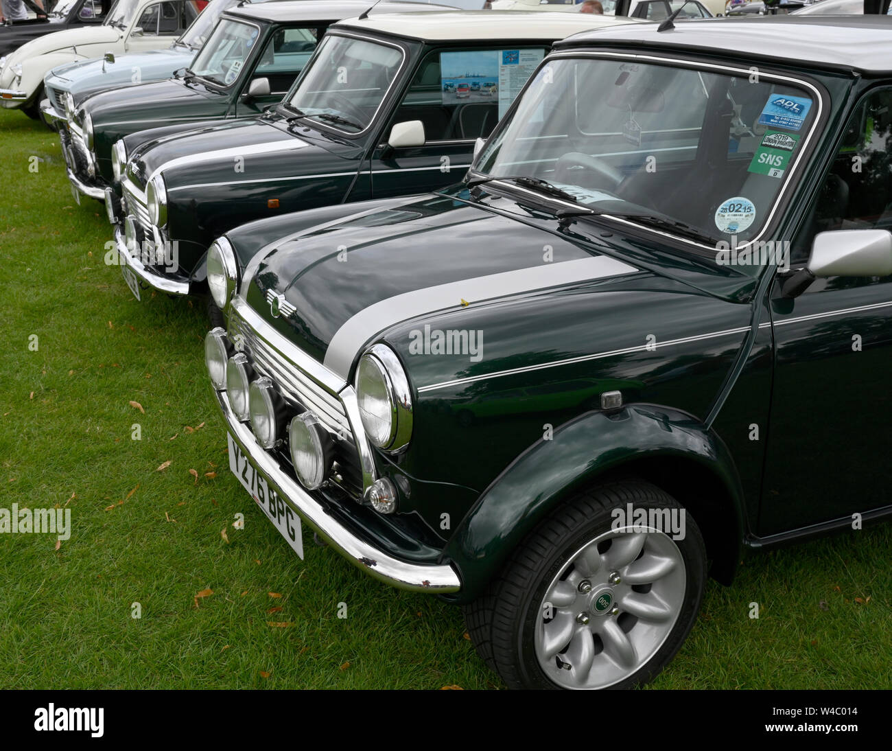 Line of vintage mini motor cars at a public motor show. Stock Photo