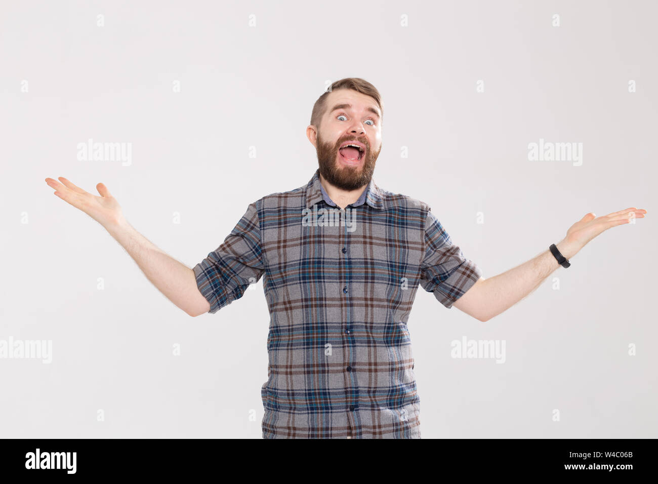 Bewildered Young Hipster Man With A Mustache And A Beard With Glasses ...