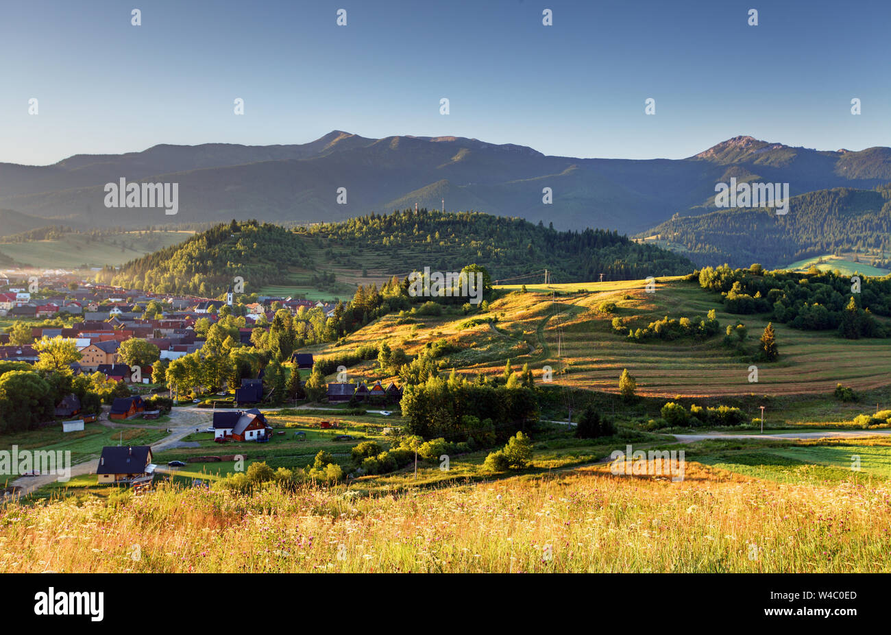 Mountain village in the alps Stock Photo - Alamy