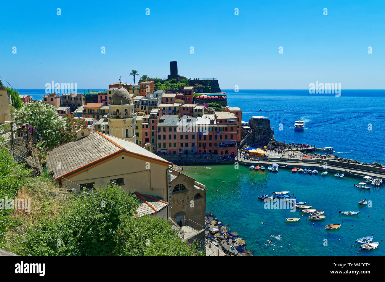 Vernazza village in Cinque Terre, Italy. View of the harbor with colored houses and boats. Stock Photo