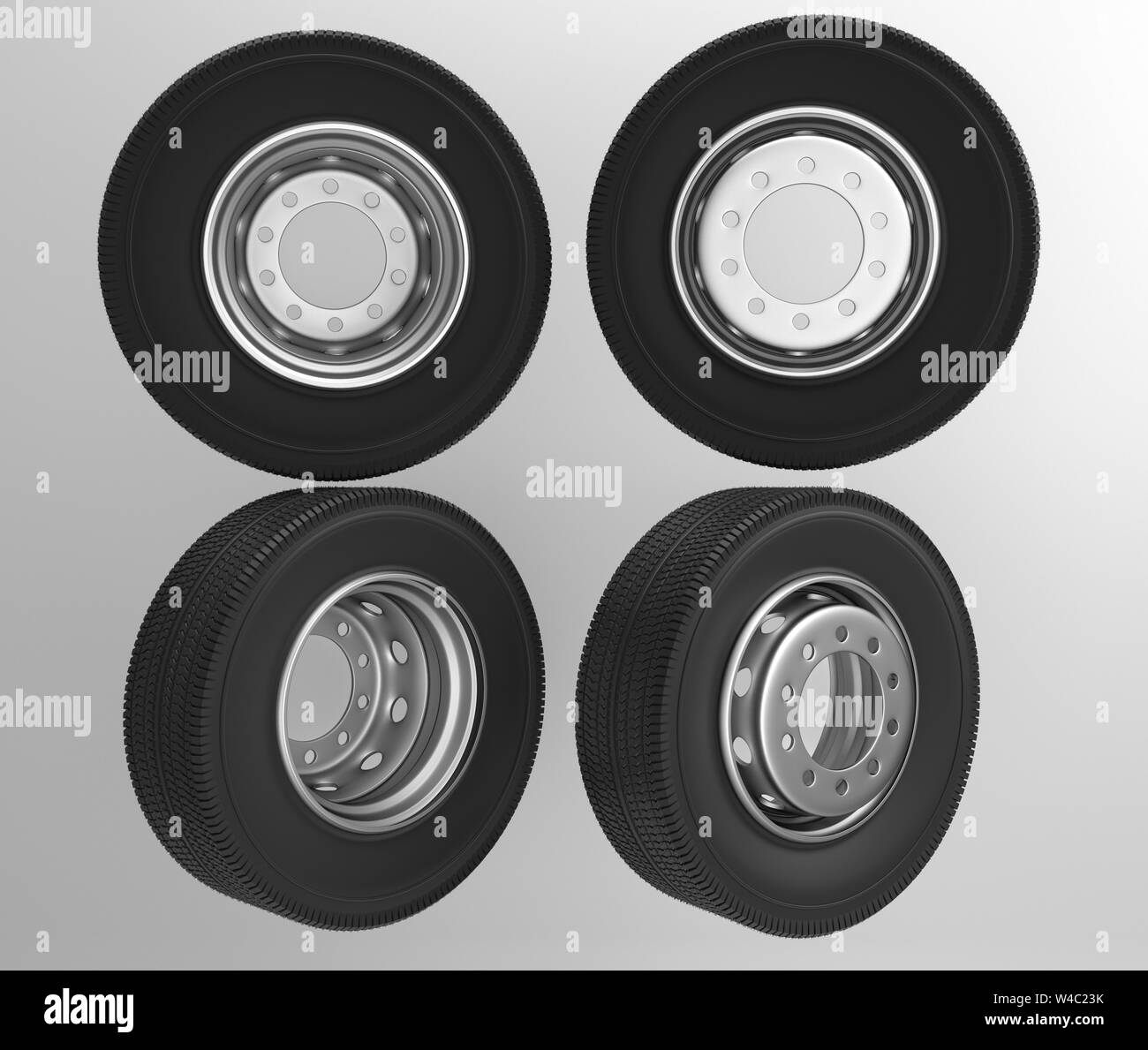 Isolated on white background new front rear truck wheels with black shine tires. New tires for