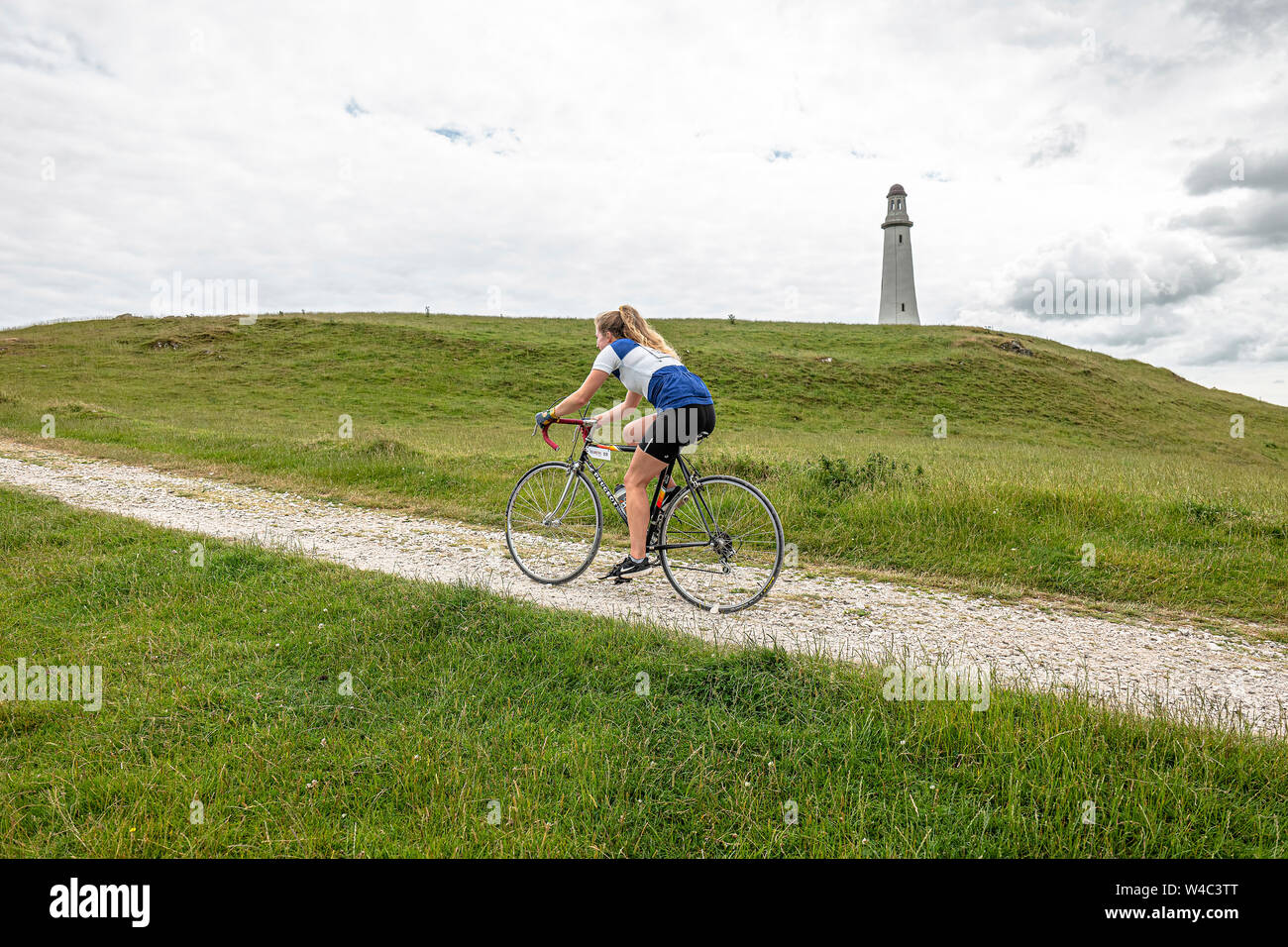 Female riding a bike hires stock photography and images Alamy