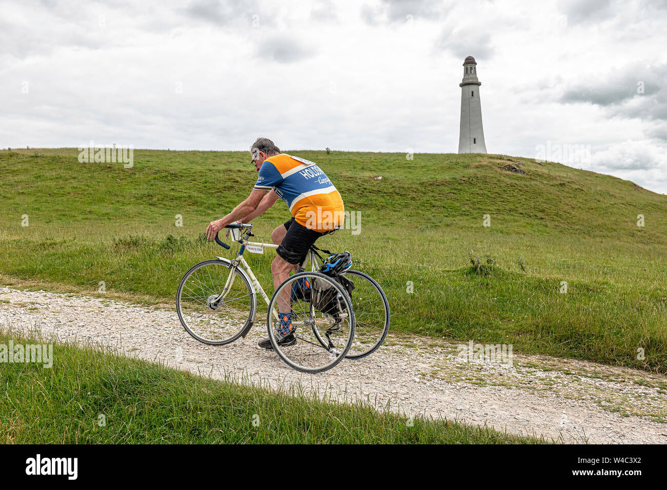 Cyclist climbing up to the Hoad Monument at Veloretro vintage cycling event in Ulverston, Cumbria. Stock Photo