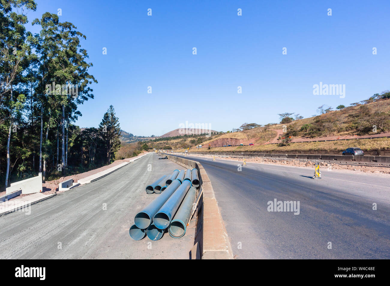 Road Highway industrial construction expansion of new traffic routes lanes entry exit ramps to existing network. Stock Photo
