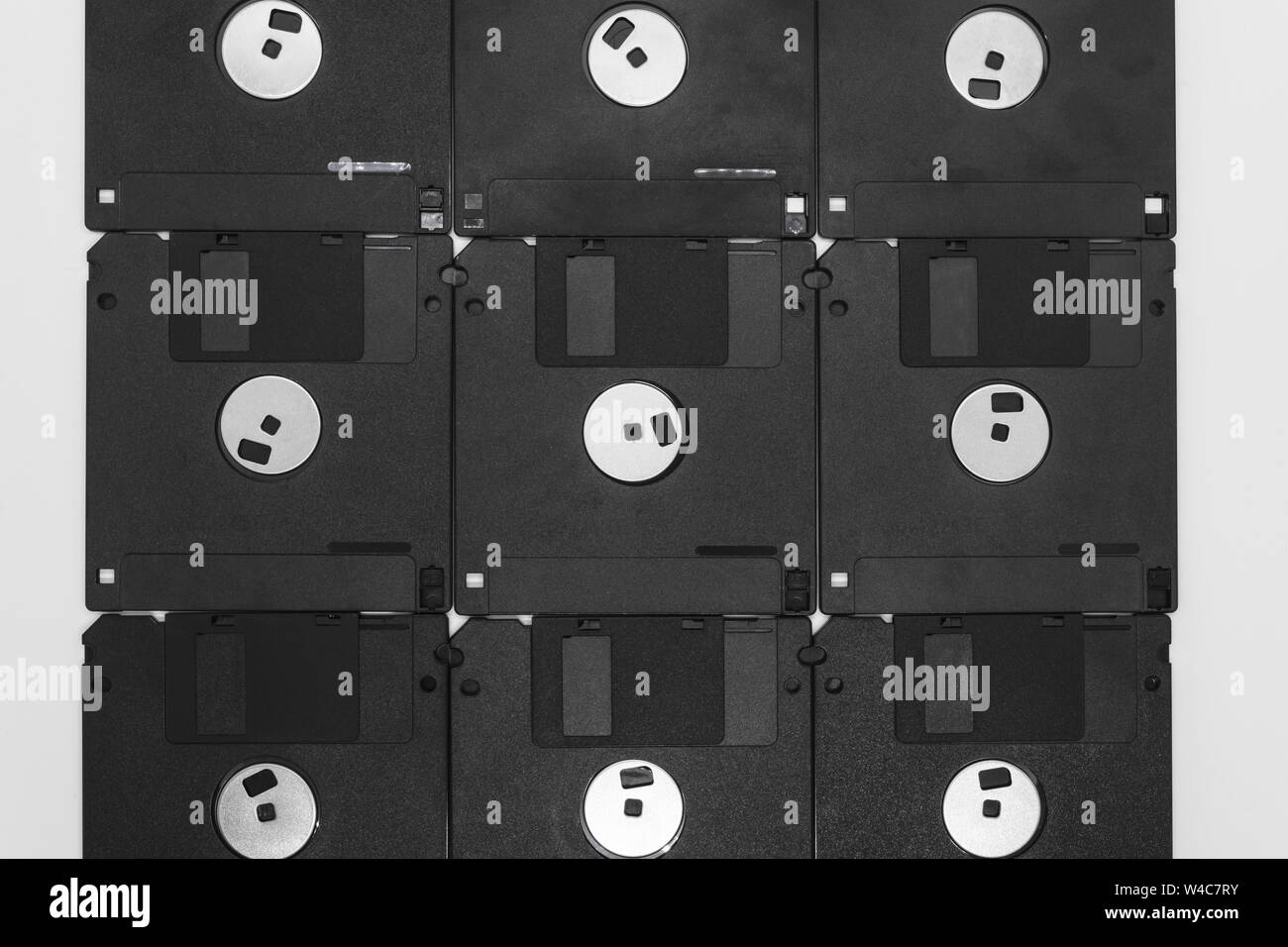 Background of bunch black floppy disks on white background Stock Photo