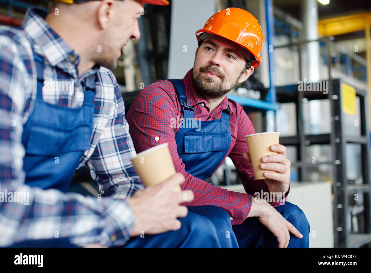 Hard hats in warehouse hires stock photography and images Alamy