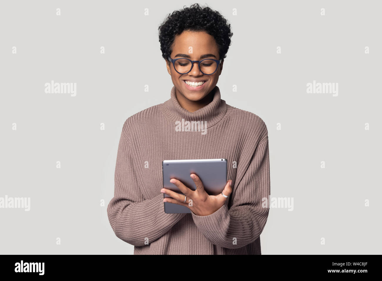 African american girl smiling using hi-res stock photography and images ...