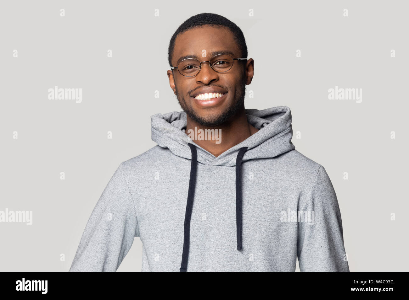 Smiling black male in hoodie posing for picture Stock Photo