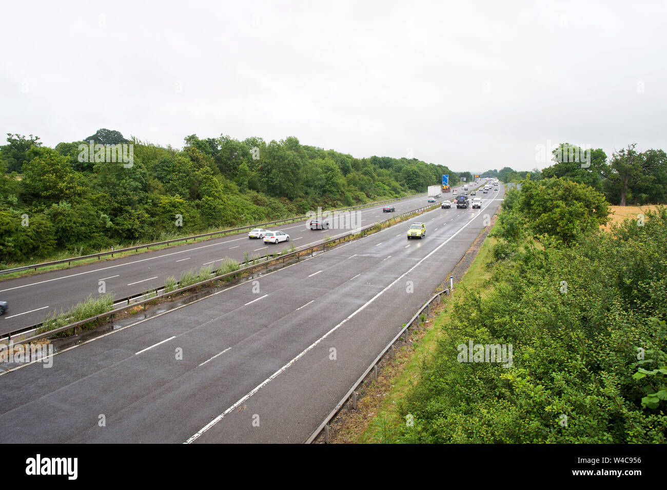 Motorway Traffic follows an emergency vehicle after the M40 near Warwick was closed due to a lorry fire. 19 July 2019. Stock Photo