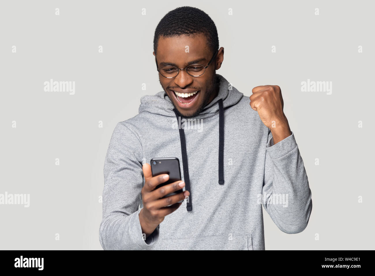 Excited black man hi-res stock photography and images - Alamy