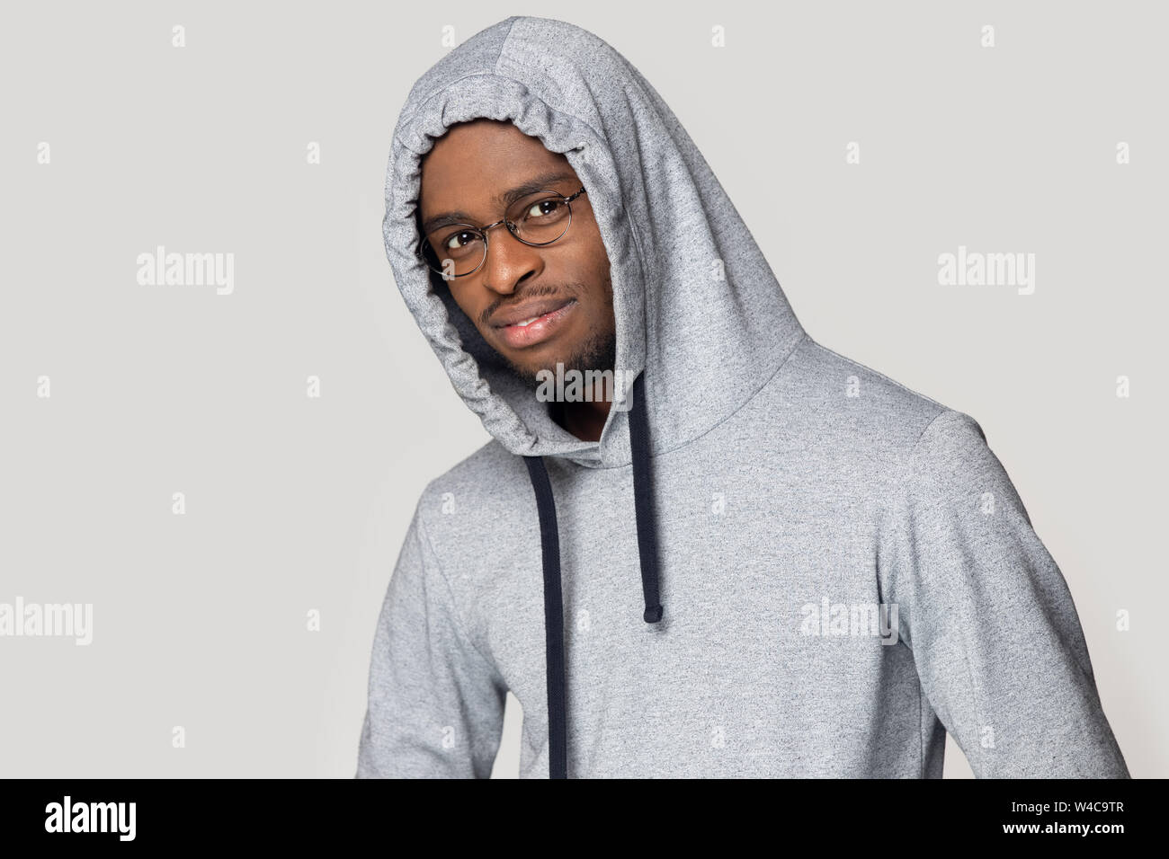 Black young guy wearing hoodie posing looking at camera Stock Photo