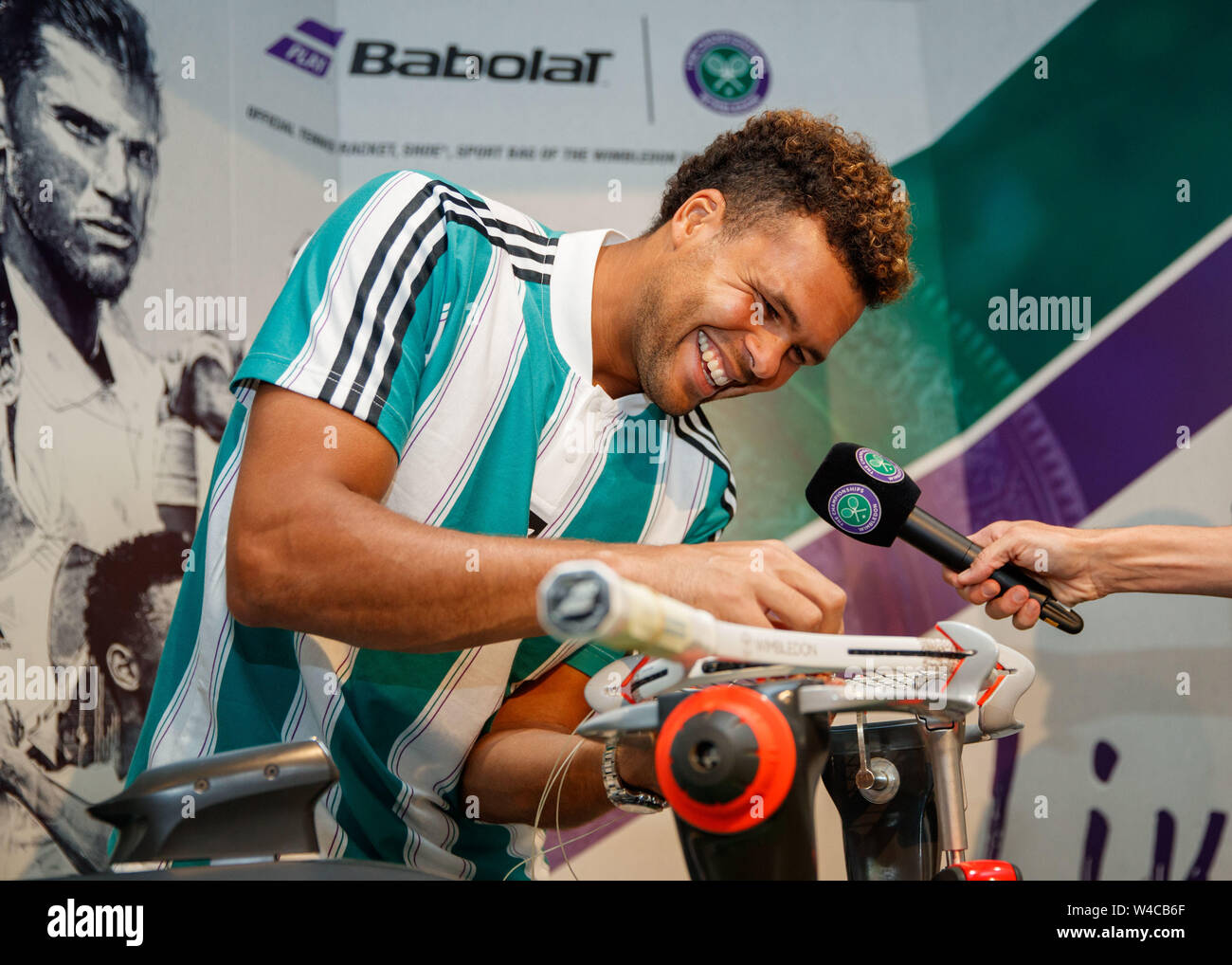Jo-Wilfred Tsonga stringing a racket at The Wimbledon Championships 2019. Held at The All England Lawn Tennis Club, Wimbledon. Stock Photo