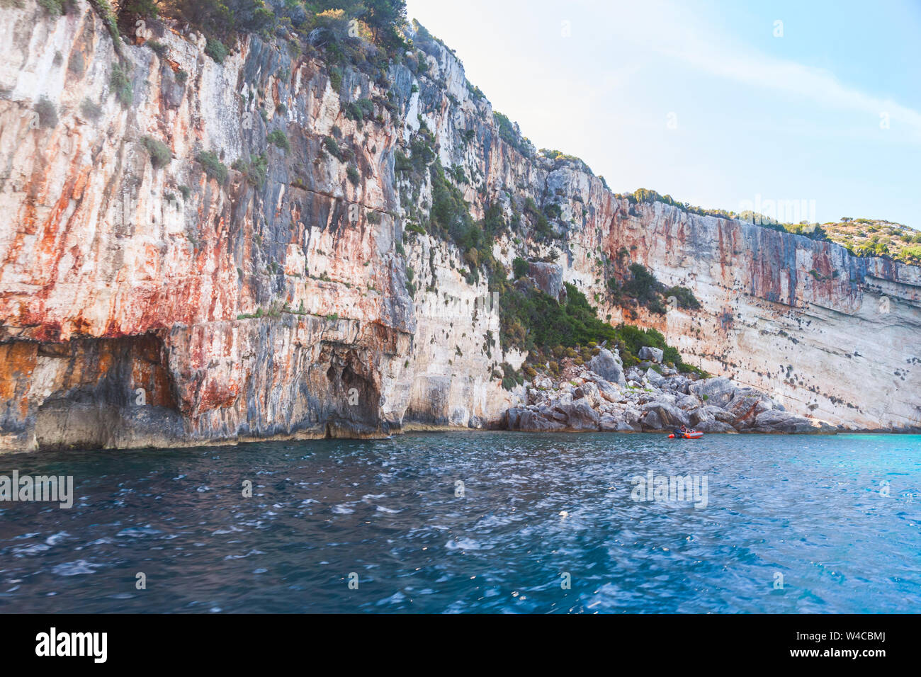 Coastal landscape with arches in rocks of Greek island Zakynthos. Blue cave, natural landmark Stock Photo