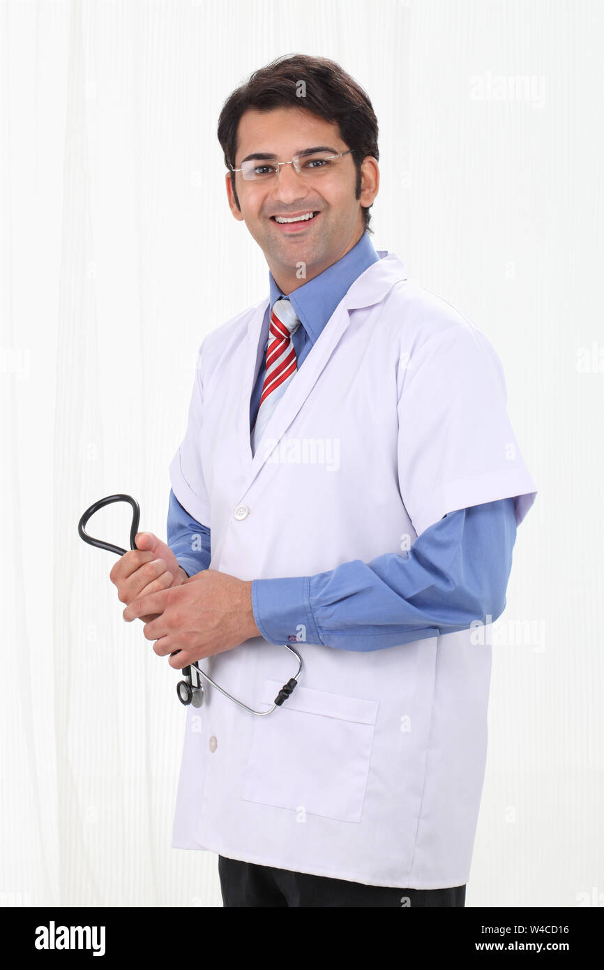 Portrait of a male doctor smiling Stock Photo - Alamy
