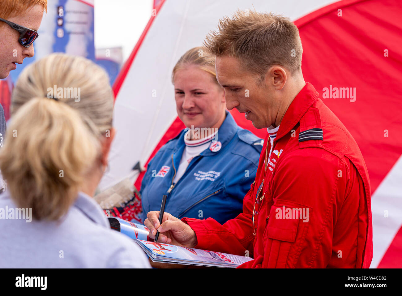 Flt Lt Jon Bond Red Arrows pilot signing autographs and meeting fans at Royal International Air Tattoo airshow, Cotswolds, UK. RAF display team Stock Photo