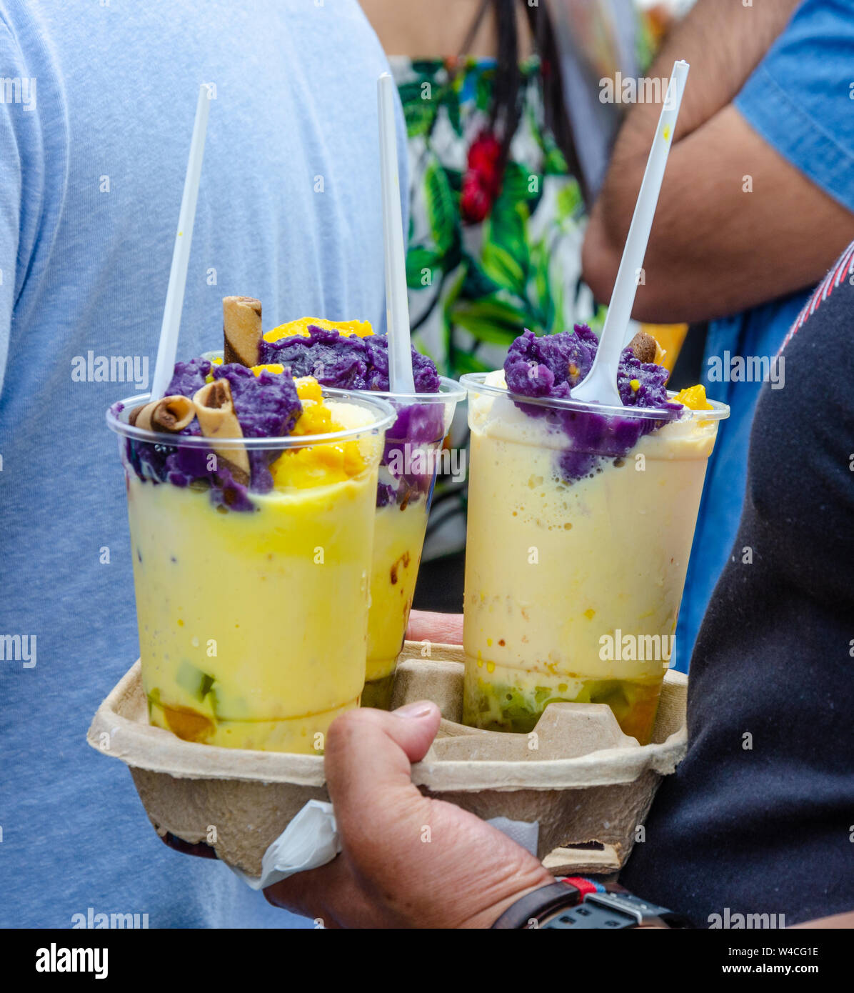Halo halo is a populat Filipino cold dessert or drink made from crushed ice, evaporated milk and fruits. Stock Photo