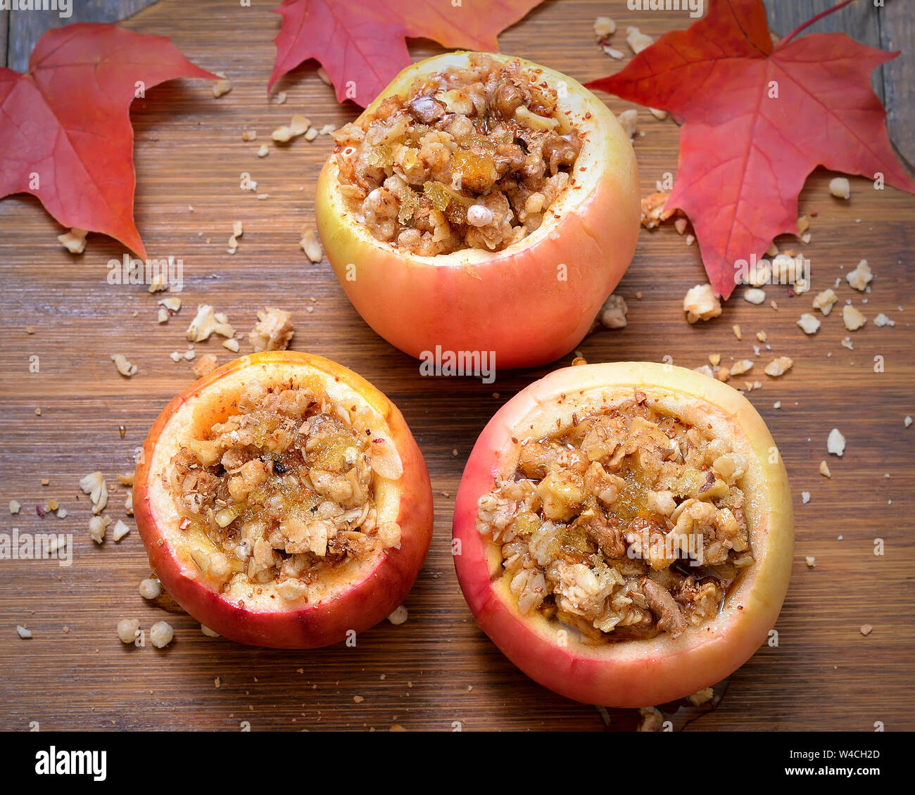 Baked apples stuffed with nut, honey and granola, top view Stock Photo