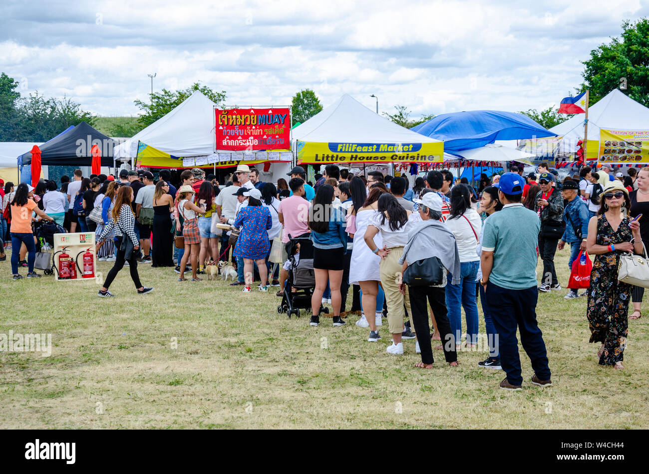 People queue to buy food at a street food stall at the London Barrios Fiesta 2019. Stock Photo