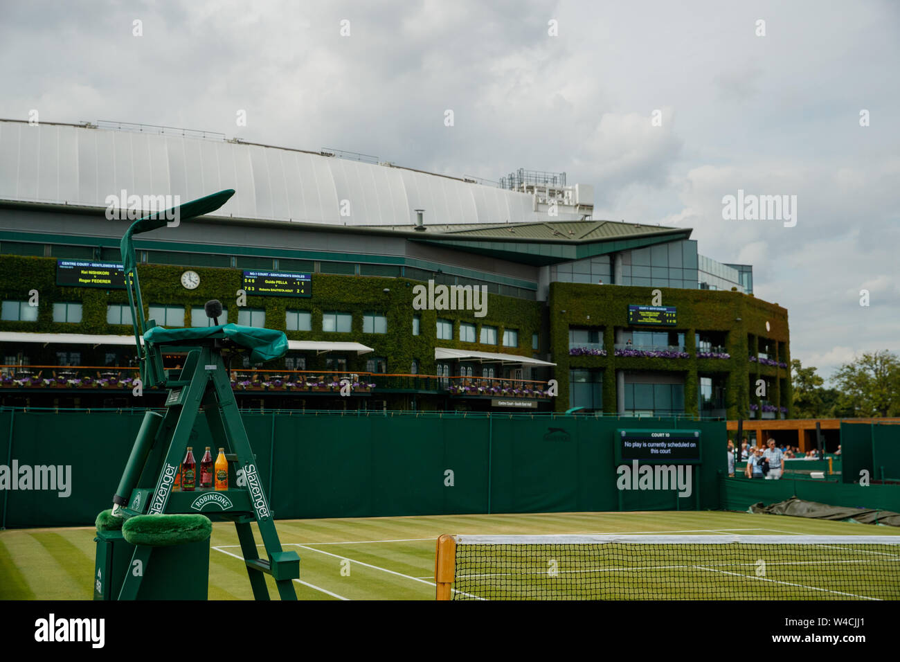 General views of Court 9 and Centre Court during the Wimbledon Championships 2019. Held at The All England Lawn Tennis Club, Wimbledon. Stock Photo