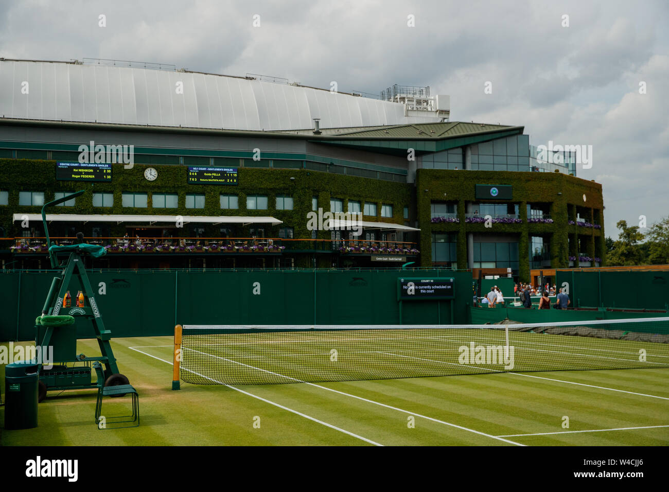General views of Court 9 and Centre Court during the Wimbledon Championships 2019. Held at The All England Lawn Tennis Club, Wimbledon. Stock Photo