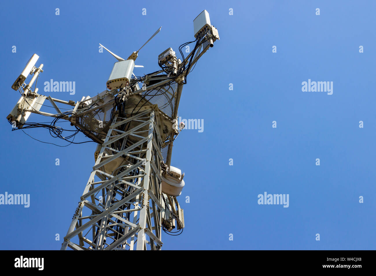 Cellular Base Station or Base Transceiver Station. Telecommunication tower. Wireless Communication Antenna Transmitter. 3G, 4G and 5G Cell Site with Stock Photo