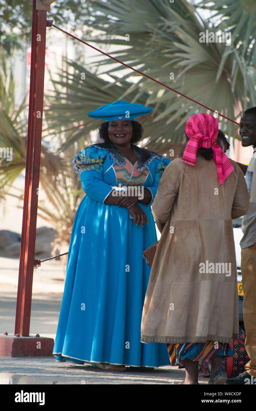 Herero women in traditional dress. The Herero, (AKA Ovaherero), are an ethnic group inhabiting parts of Southern Africa. The majority reside in Namibi Stock Photo