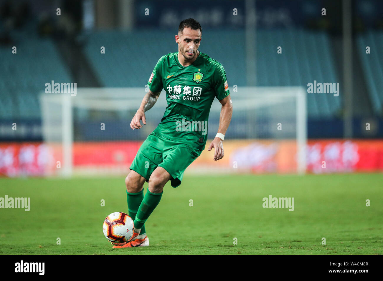 Brazilian football player Renato Soares de Oliveira Augusto, or simply Renato Augusto, of Beijing Sinobo Guoan F.C. keeps the ball during the 19th round of Chinese Football Association Super League (CSL) against Jiangsu Suning in Nanjing, east China’s Jiangsu province on 21 July 2019. Jiangsu Suning wins in the match with a 1-0. Stock Photo