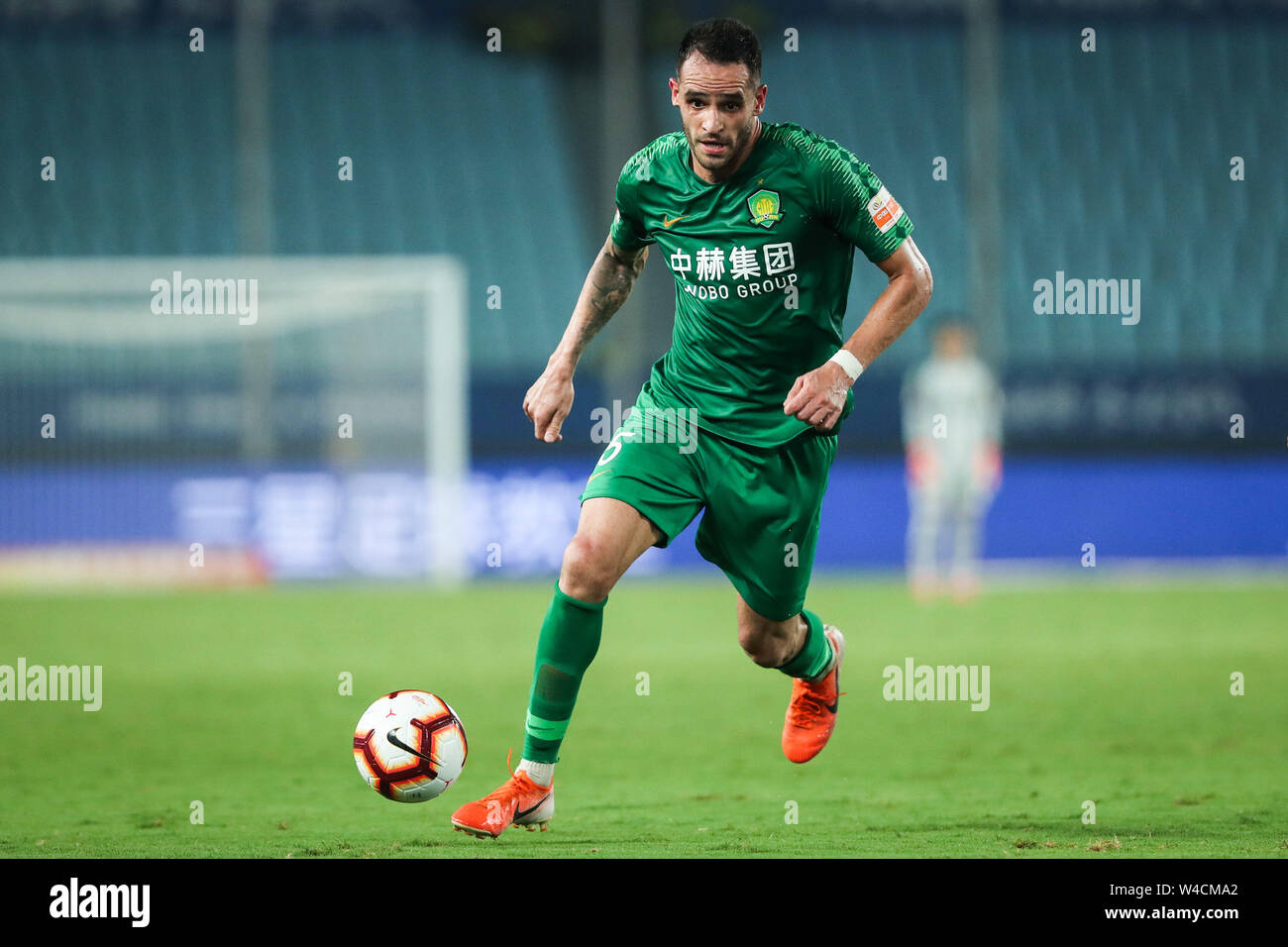 Brazilian football player Renato Soares de Oliveira Augusto, or simply Renato Augusto, of Beijing Sinobo Guoan F.C. keeps the ball during the 19th round of Chinese Football Association Super League (CSL) against Jiangsu Suning in Nanjing, east China’s Jiangsu province on 21 July 2019. Jiangsu Suning wins in the match with a 1-0. Stock Photo