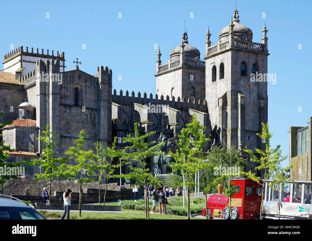 Porto Cathedral, the Se, exterior, twin towers, mixed architectural styles, old Catholic church, religious building, UNESCO site, tourist train, Europ Stock Photo