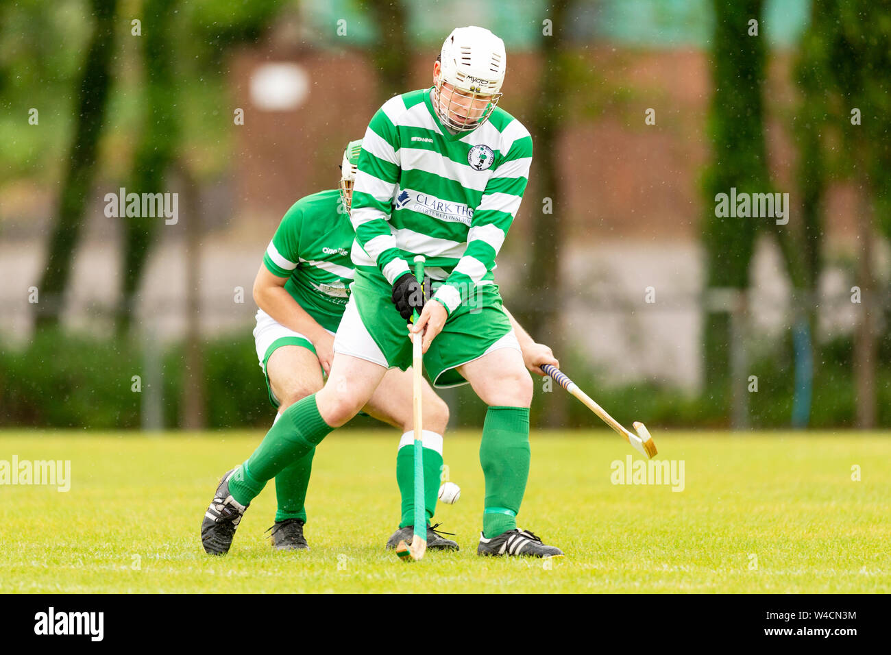Golfer Robert MacIntyre finished 6th in his first Major, The British Open, in July 2019.  Here he is pictured playing shinty for Oban Celtic. Stock Photo