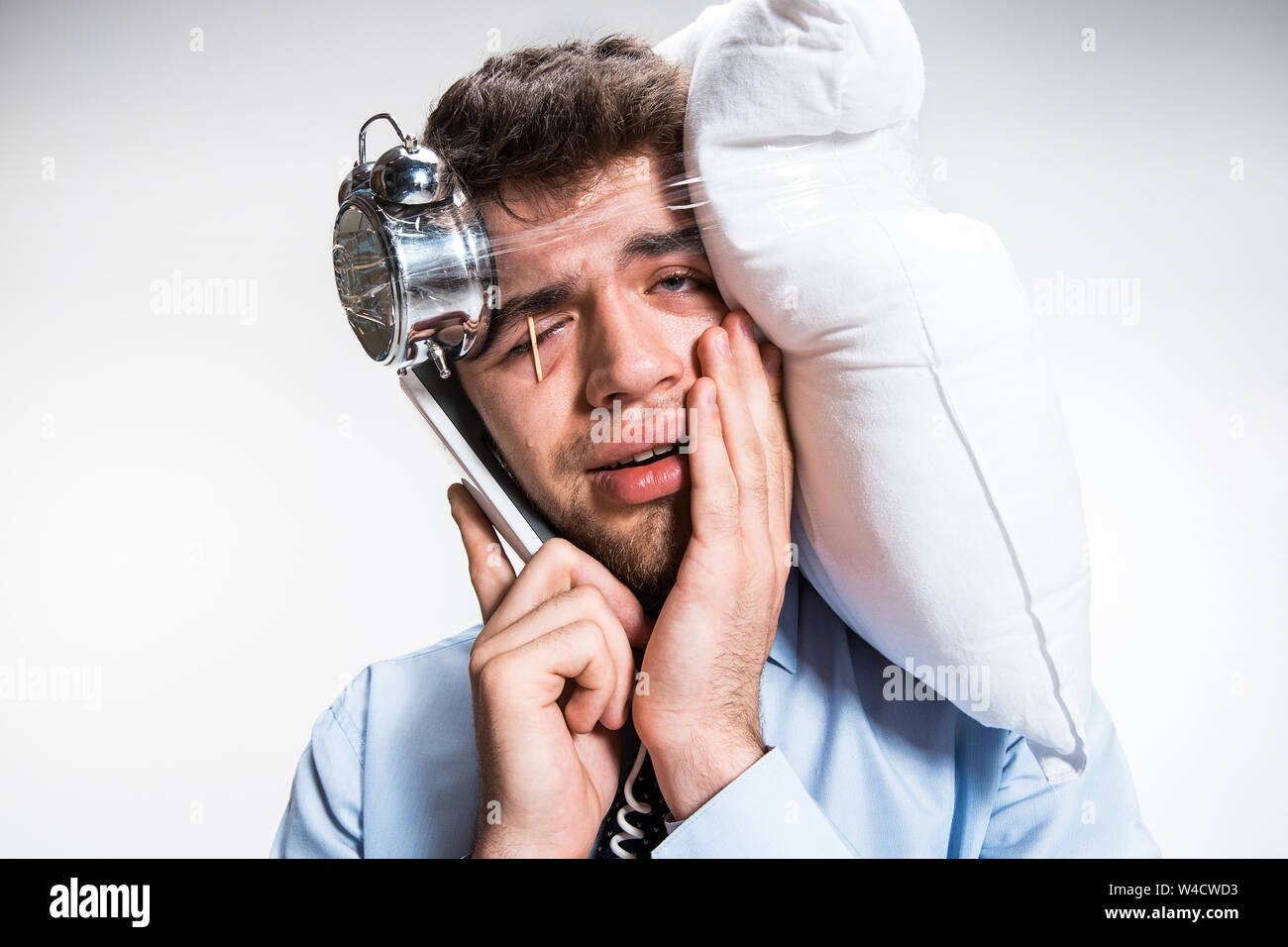 Has no time for sleep. Young man getting deadline, being under the