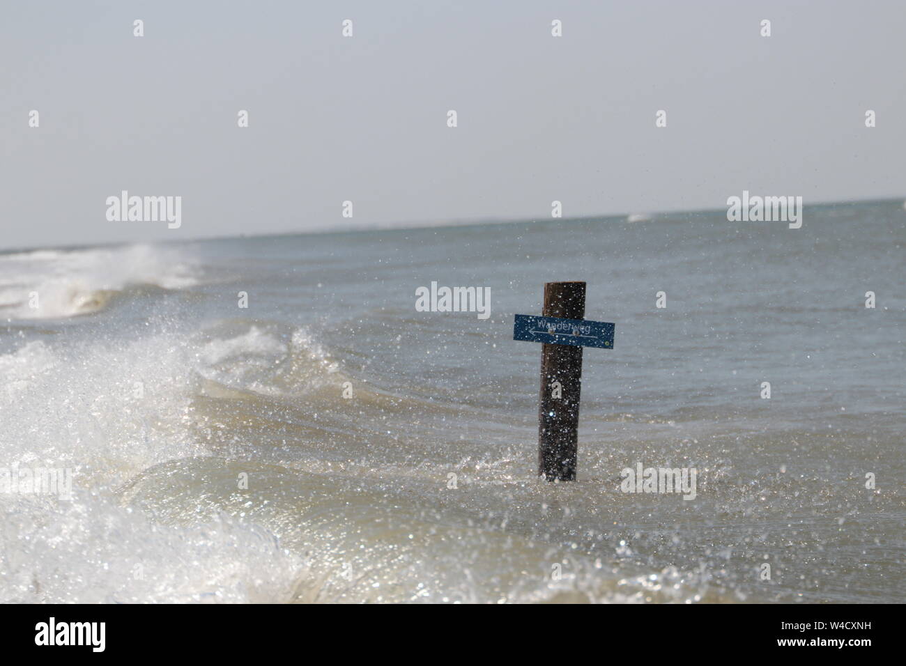 guide sign at Borkum beach in splashy water Stock Photo